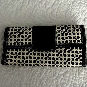 Black and white Coach wallet.